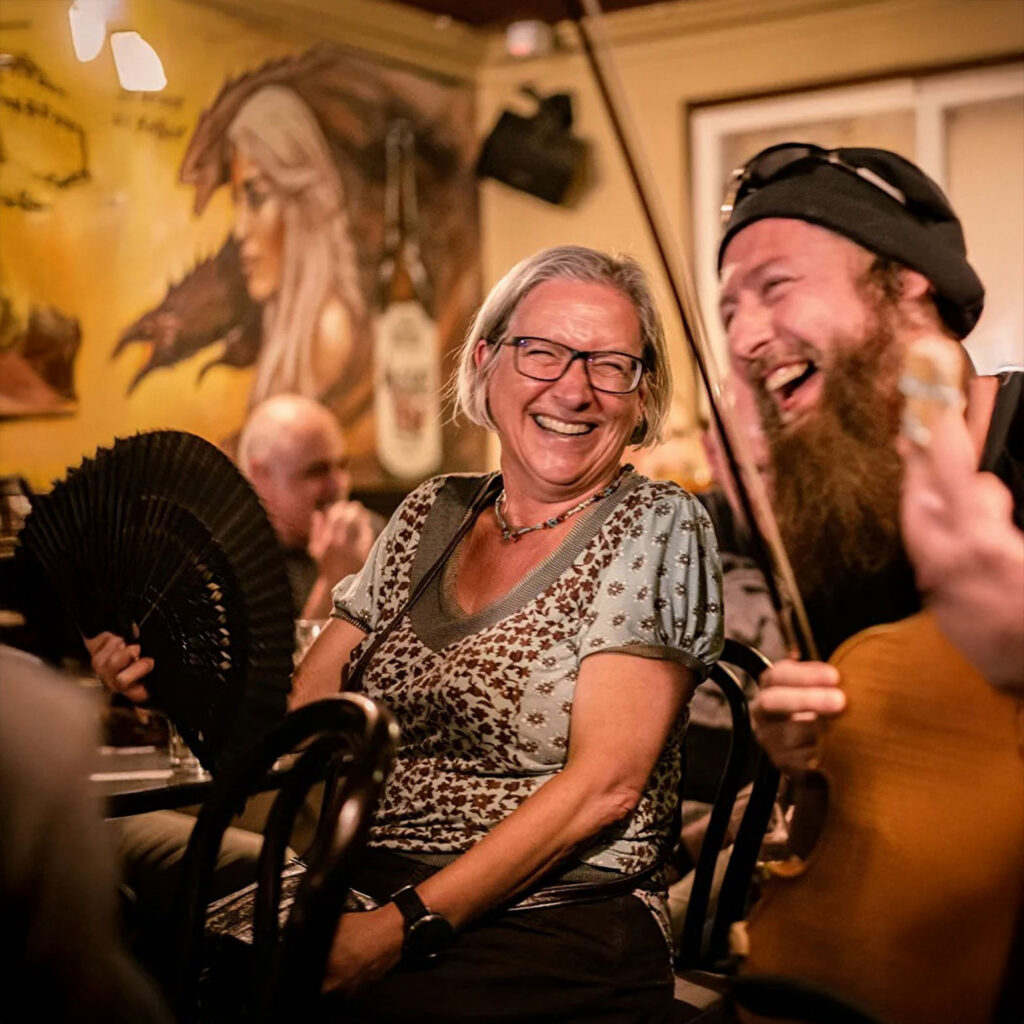 Laughing session musicians in a pub