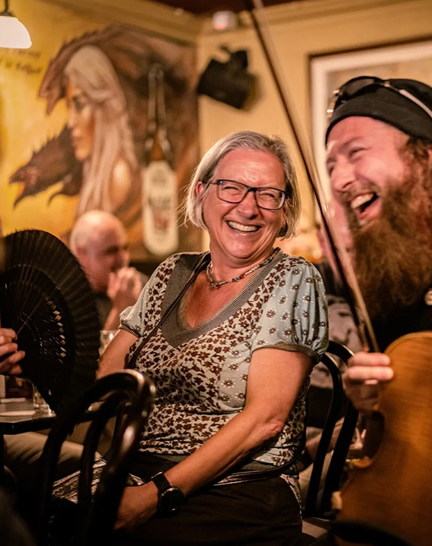 Laughing session musicians in a pub